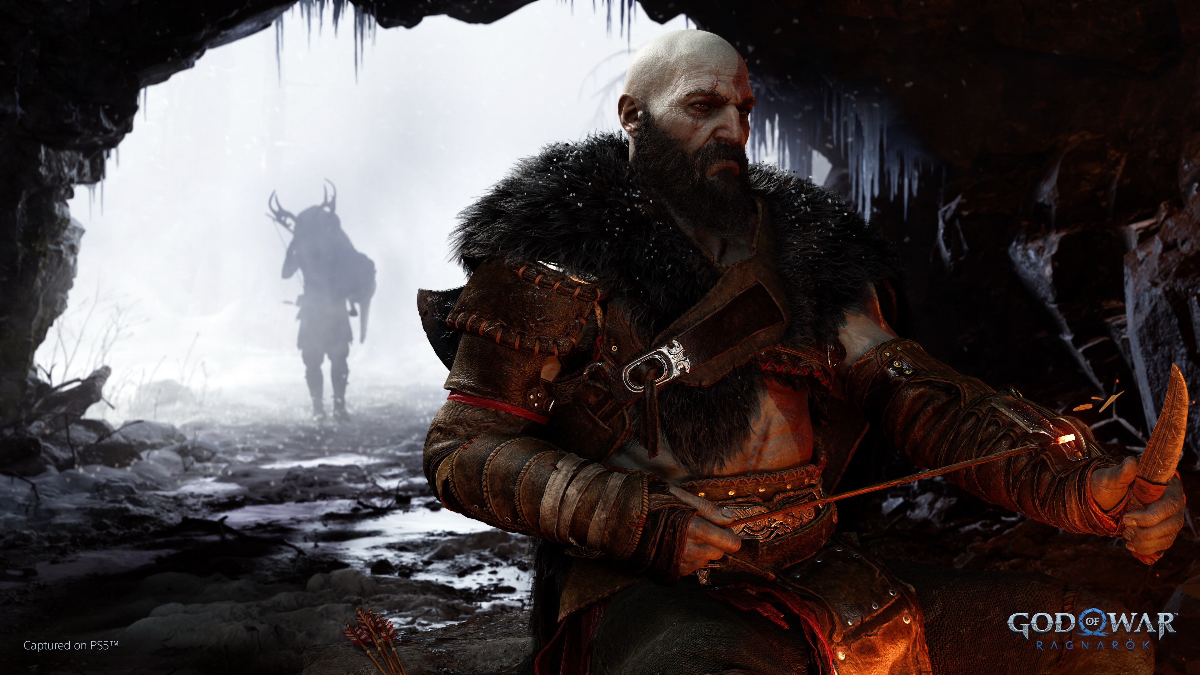 Kratos sitting and Atreus in the background carrying a deer