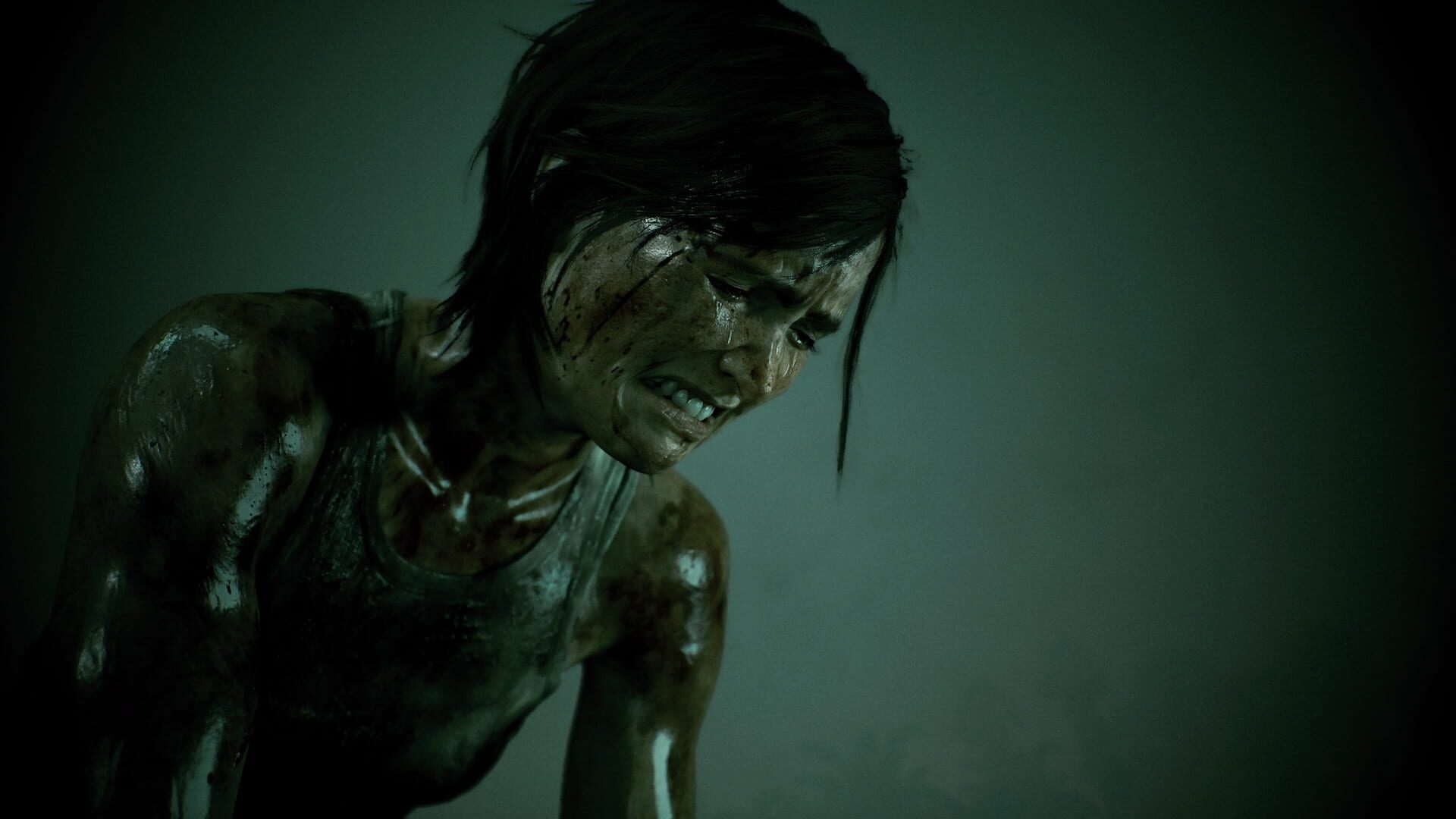 An exhausted Ellie kneeling, covered in mud and blood